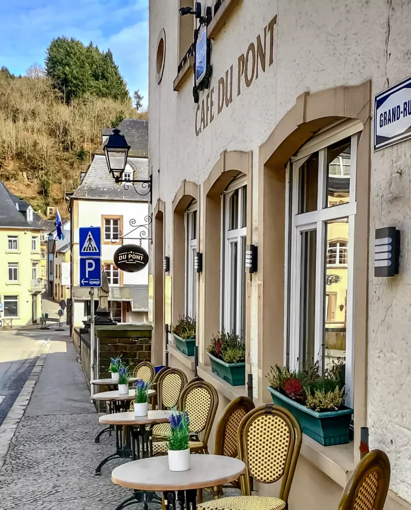 Outdoor seating area of Café-Restaurant Du Pont on the main street of Vianden, photographed by owner John Staats.
